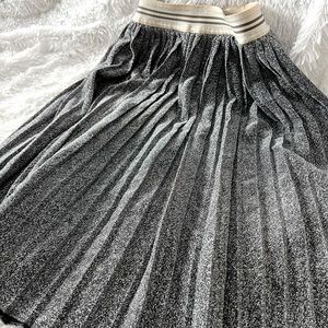 Lovely vintage pleated circle skirt with elastic waist. No flaws.